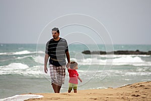 Father and son on beach