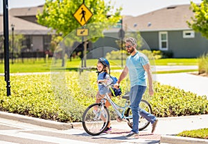 father and son on bicycle at fathers day. active father setting a example for fathers son. fathers parenting with son