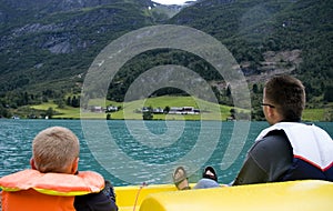 Father and son boating on lake