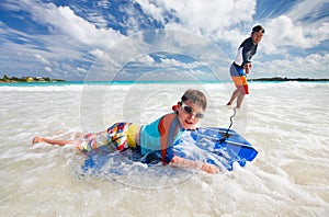 Father and son boogie boarding