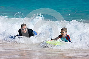 Father and son boogie boarding