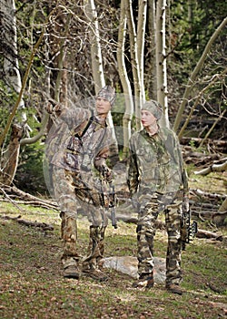 Father and son bow hunting together