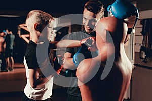 Father And Son Boxing Exercises Training In Gym.