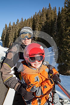 The father with son on chair lift