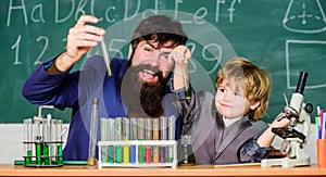 Father and son child at school. bearded man teacher with little boy. Chemistry beaker experiment. Laboratory test tubes