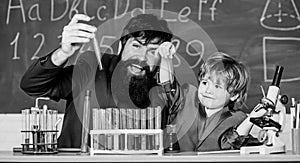 Father and son child at school. bearded man teacher with little boy. Chemistry beaker experiment. Laboratory test tubes