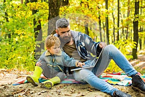 Father and son concept. Parent teach baby. Happy Father and son with spending time outdoor in the autumn park. Kid and