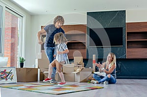 Father and son dancing while mother looks at them