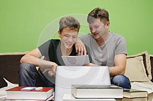 Father and son doing homework together
