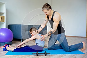 Father and son doing sit ups