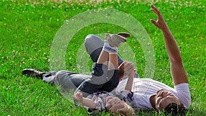 Father and son dreaming on the grass