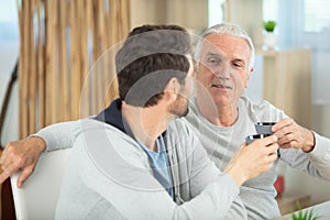father and son drinking coffee