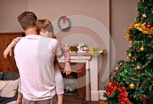 Father, son and embrace with comfort on christmas for celebration, sleeping and love in the morning. Family, man and