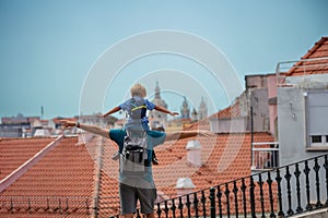 Father and son enjoy summer in Lisbon do sightseeing