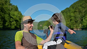 Father and Son Enjoying a Boat Ride