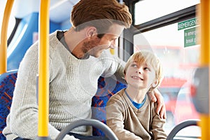 Father And Son Enjoying Bus Journey Together