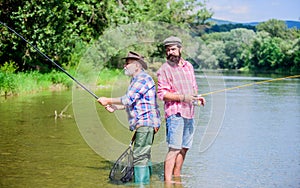 Father and son fishing. Fisherman family. Hobby sport activity. Summer weekend. Peaceful activity. Nice catch. Rod and