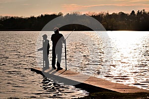 Father and Son Fishing on Pier at the Lake