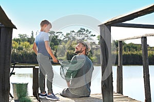 Father and son fishing together