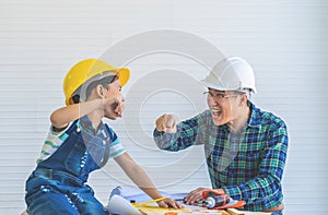 Father and Son fist bump for success concept in construction industry concept