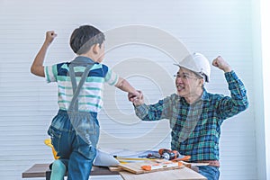Father and Son fist bump for success in construction industry concept