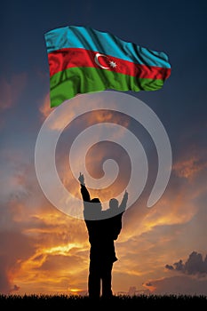 Father with son and the flag of Azerbaijan