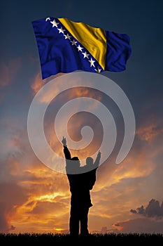 Father with son and the flag of Bosnia