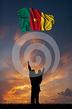 Father with son and the flag of Cameroon