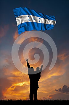 Father with son and the flag of Honduras