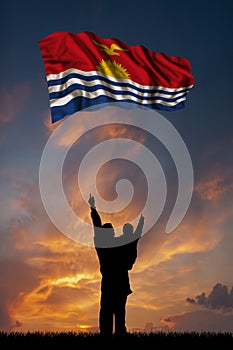 Father with son and the flag of Kiribati