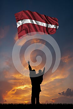 Father with son and the flag of Latvia