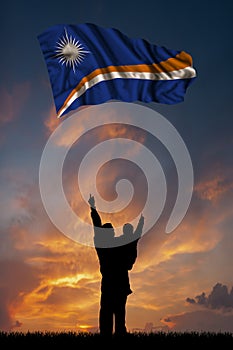 Father with son and the flag of Marshall Islands