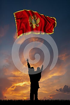 Father with son and the flag of Montenegro