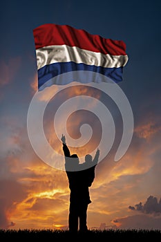 Father with son and the flag of Netherlands