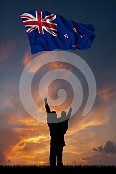 Father with son and the flag of New Zealand
