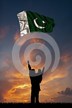 Father with son and the flag of Pakistan