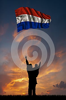 Father with son and the flag of Paraguay