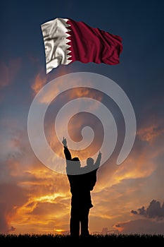 Father with son and the flag of Qatar