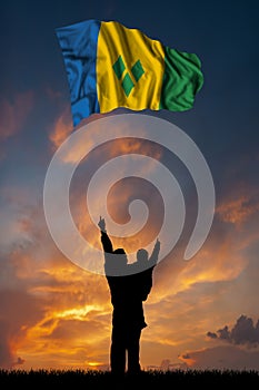 Father with son and the flag of Saint Vincent and the Grenadines