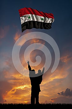 Father with son and the flag of Syria