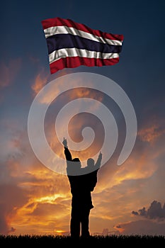 Father with son and the flag of Thailand