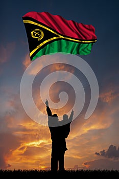 Father with son and the flag of Vanuatu