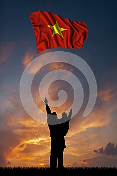 Father with son and the flag of Vietnam