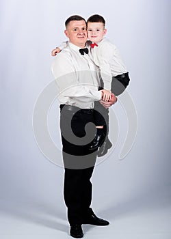 Father and son in formal suit. small boy with dad gentleman. family day. male fashion. parenting. fathers day. child