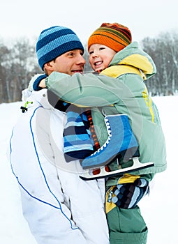 Father and son go ice skating