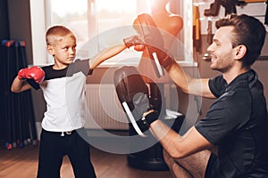 Father and son in the gym. Father and son spend time together and lead a healthy lifestyle.