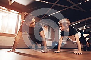 Father and son in the gym. Father and son spend time together and lead a healthy lifestyle. photo