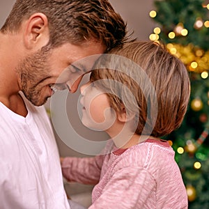 Father, son and happy with bonding on christmas for celebration, playing and love in the morning with comfort. Family