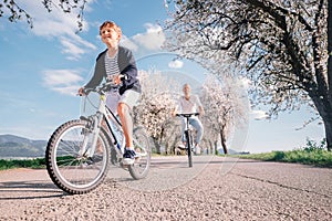 Father and son have a fun active leisure together - ride bicycle