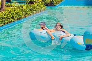 Father and son have fun at the water park